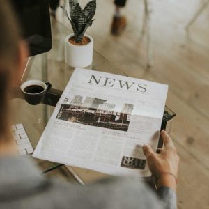 Businessman on his desk with a newspaper